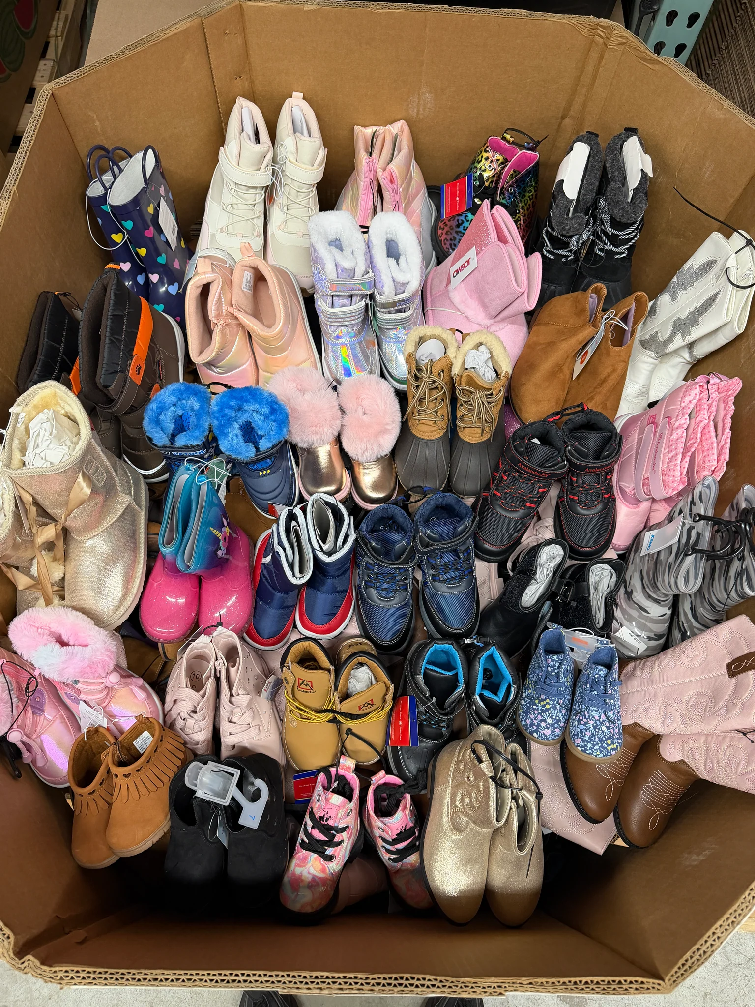 Target Kids Boots Wholesale Pallet with 150 pairs of children's winter boots, rain boots, snow boots, and casual boots for wholesale resale.