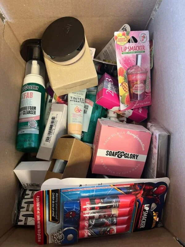 Makeup Mystery Box Pallets with 5 wholesale beauty mystery boxes containing assorted cosmetics, skincare products, makeup brushes, and beauty accessories