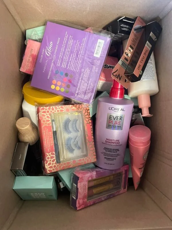 Makeup Mystery Box Pallets with 5 wholesale beauty mystery boxes containing assorted cosmetics, skincare products, makeup brushes, and beauty accessories