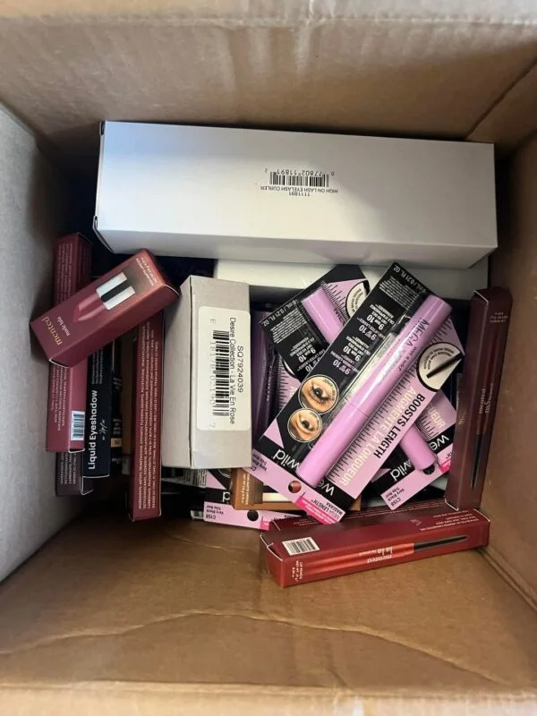 Makeup Mystery Box Pallets with 5 wholesale beauty mystery boxes containing assorted cosmetics, skincare products, makeup brushes, and beauty accessories