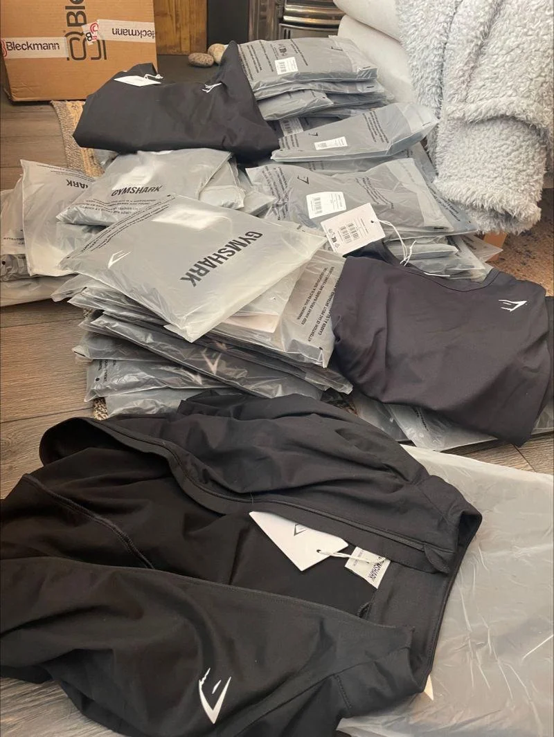 Gymshark Clothing Pallets with 450 to 500 premium activewear pieces including leggings, sports bras, hoodies, joggers, shorts, and fitness apparel for wholesale resale