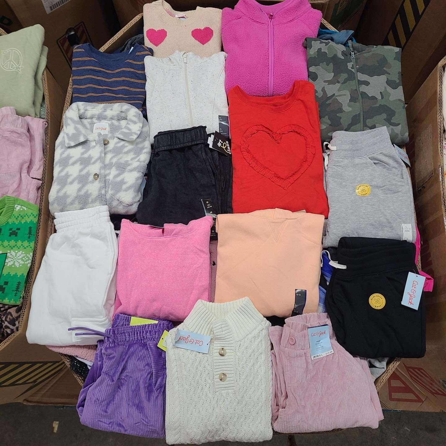 Target Kids Winter Clothes pallet with 350 to 400 pieces of children's winter apparel including jackets, hoodies, sweaters, joggers, and seasonal clothing