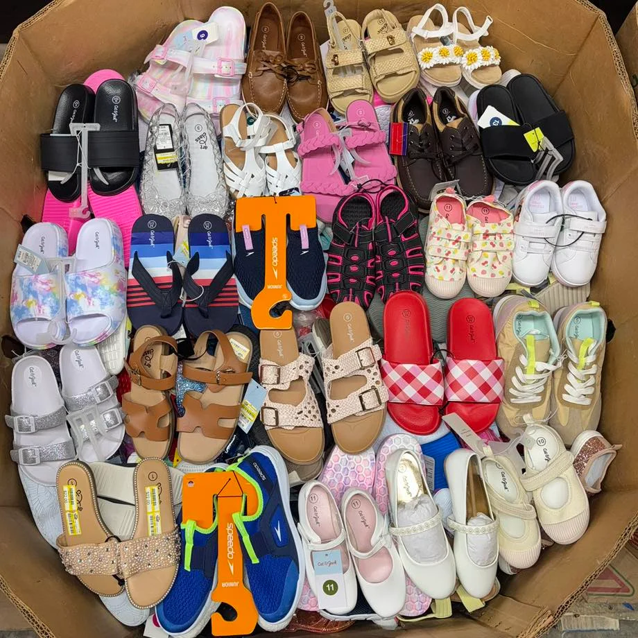 Target Kids Shoes Pallets with approximately 250 pairs of children's footwear including sneakers, school shoes, sandals, boots, athletic shoes, and casual shoes from Target liquidation inventory.