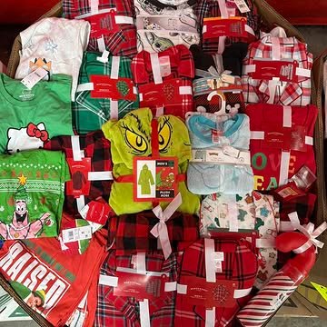 Target Christmas Clothing Pallets containing 550–650 pieces of holiday pajamas, sweaters, T-shirts, Christmas accessories, and pet apparel for wholesale resale.