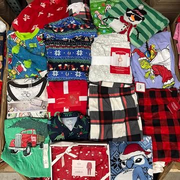 Target Christmas Clothing Pallets containing 550–650 pieces of holiday pajamas, sweaters, T-shirts, Christmas accessories, and pet apparel for wholesale resale.