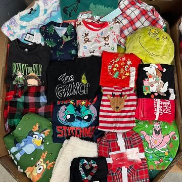 Target Christmas Clothing Pallets containing 550–650 pieces of holiday pajamas, sweaters, T-shirts, Christmas accessories, and pet apparel for wholesale resale.