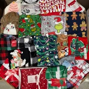 Target Christmas Clothing Pallets containing 550–650 pieces of holiday pajamas, sweaters, T-shirts, Christmas accessories, and pet apparel for wholesale resale.