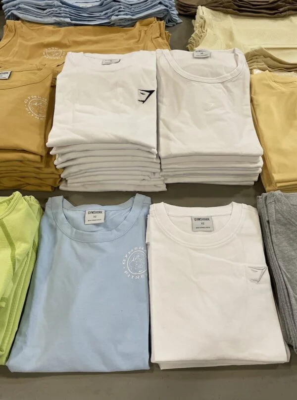 Gymshark Clothing Pallets with 450 to 500 premium activewear pieces including leggings, sports bras, hoodies, joggers, shorts, and fitness apparel for wholesale resale